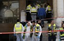 Israeli emergency personnel stand at the scene of an attack at a Jerusalem synagogue