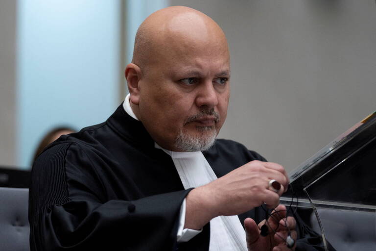 FILE PHOTO: Public Prosecutor Karim Khan prepares for the trial of Mahamat Said Abdel Kani at the International Criminal Court in The Hague